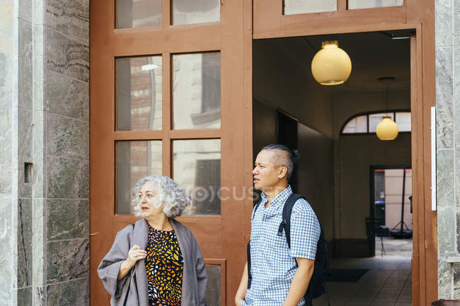 Coworkers standing in front of office — Stock Photo