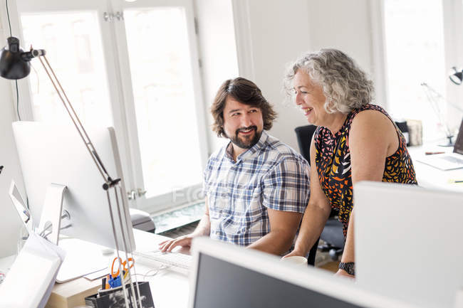 Colleagues working together in office — Stock Photo