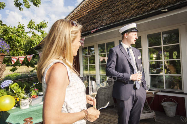 Mother and son at graduation party in garden — Stock Photo
