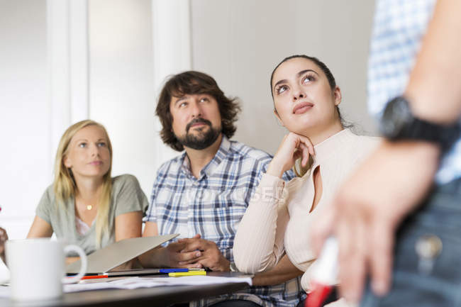 Coworkers listening during business meeting — Stock Photo