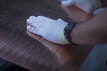 Worker hands on metal board — Stock Photo