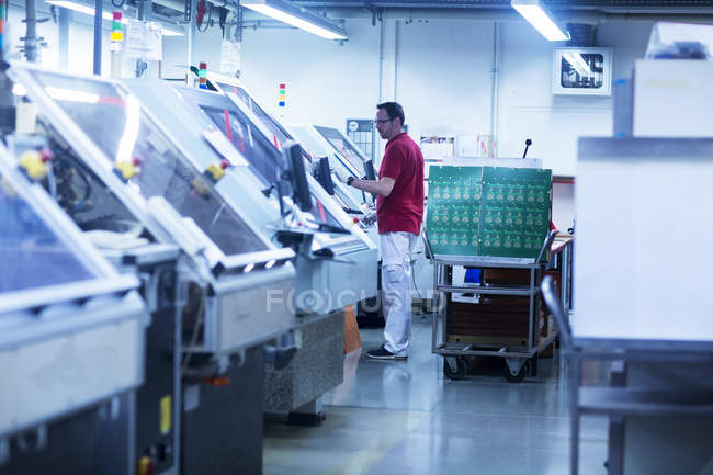 Man working at industrial plant — Stock Photo