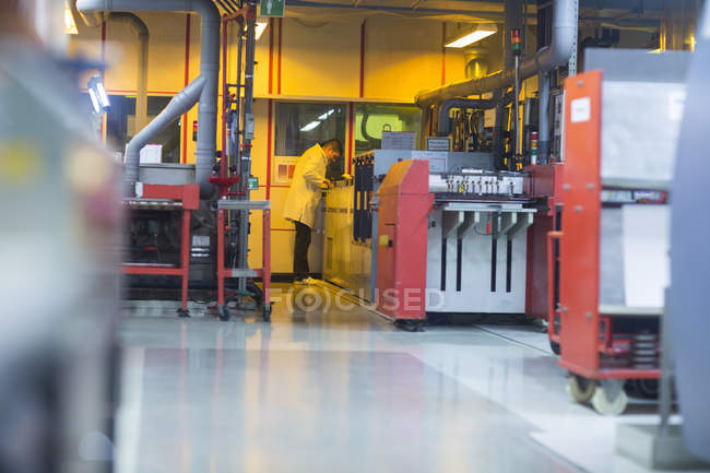 Employee working at industrial plant — Stock Photo