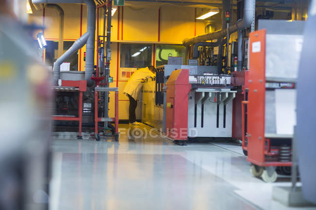 Employee working at industrial plant — Stock Photo