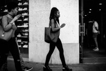 Women walking through street — Stock Photo