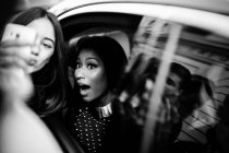Fan girl taking selfie with Nicki Minaj — Stock Photo
