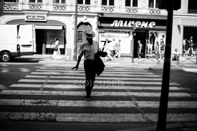 Man walking on zebra crossing — Stock Photo