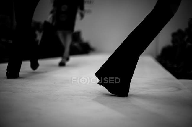 Models walking on stage — Stock Photo