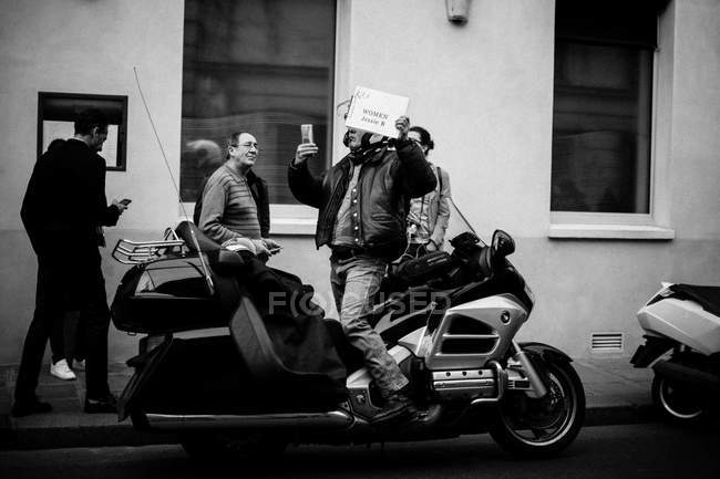 Guest taking selfie on motorbike — Stock Photo