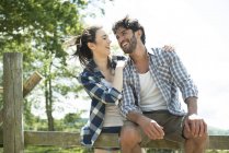Man and woman happily chatting — Stock Photo