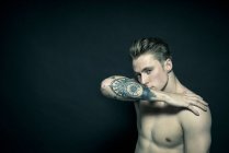 Portrait of tattooed young man — Stock Photo