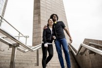 Couple standing on stairs and hugging — Stock Photo