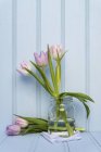 Spring flowers still life on wooden — Stock Photo