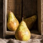 Pears in wooden box — Stock Photo