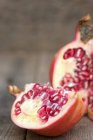 Fresh pomegranate sliced and ripped — Stock Photo