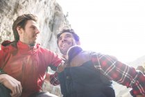 Mountaineers resting and talking during climb — Stock Photo