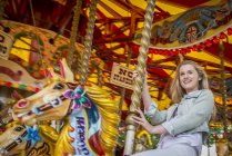 Girl riding carousel on South Bank — Stock Photo