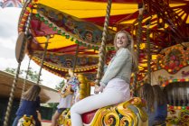 Girl riding carousel on South Bank — Stock Photo