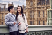 Couple standing on Westminster Bridge — Stock Photo