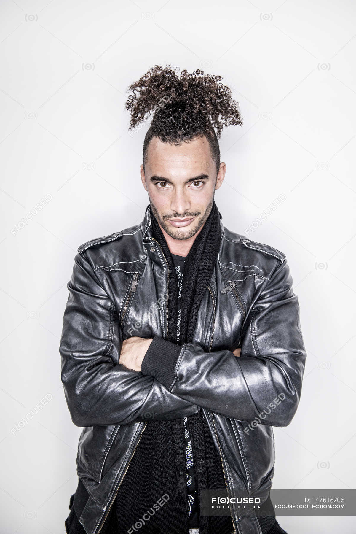 Mixed Race Man Standing With Crossed Arms White Background