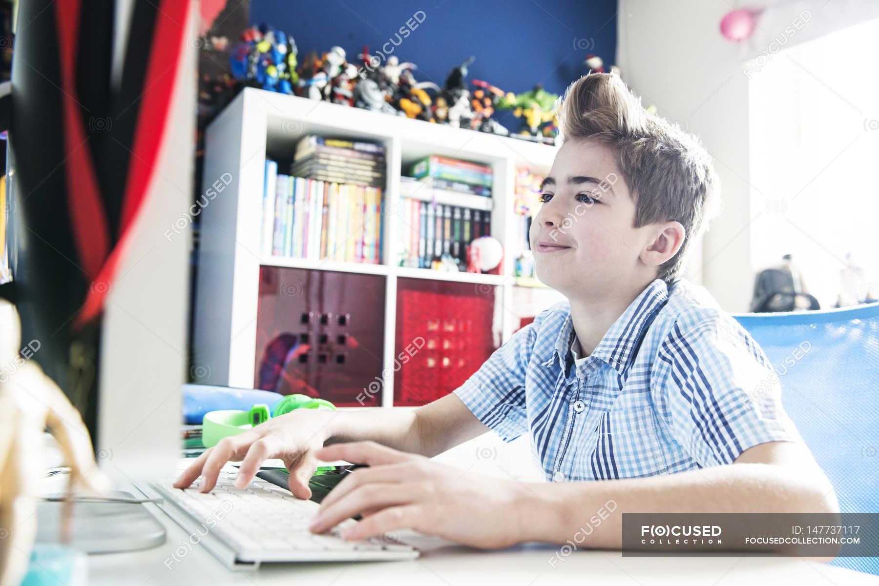 Boy playing on computer — digital, domestic room - Stock Photo | #147737117