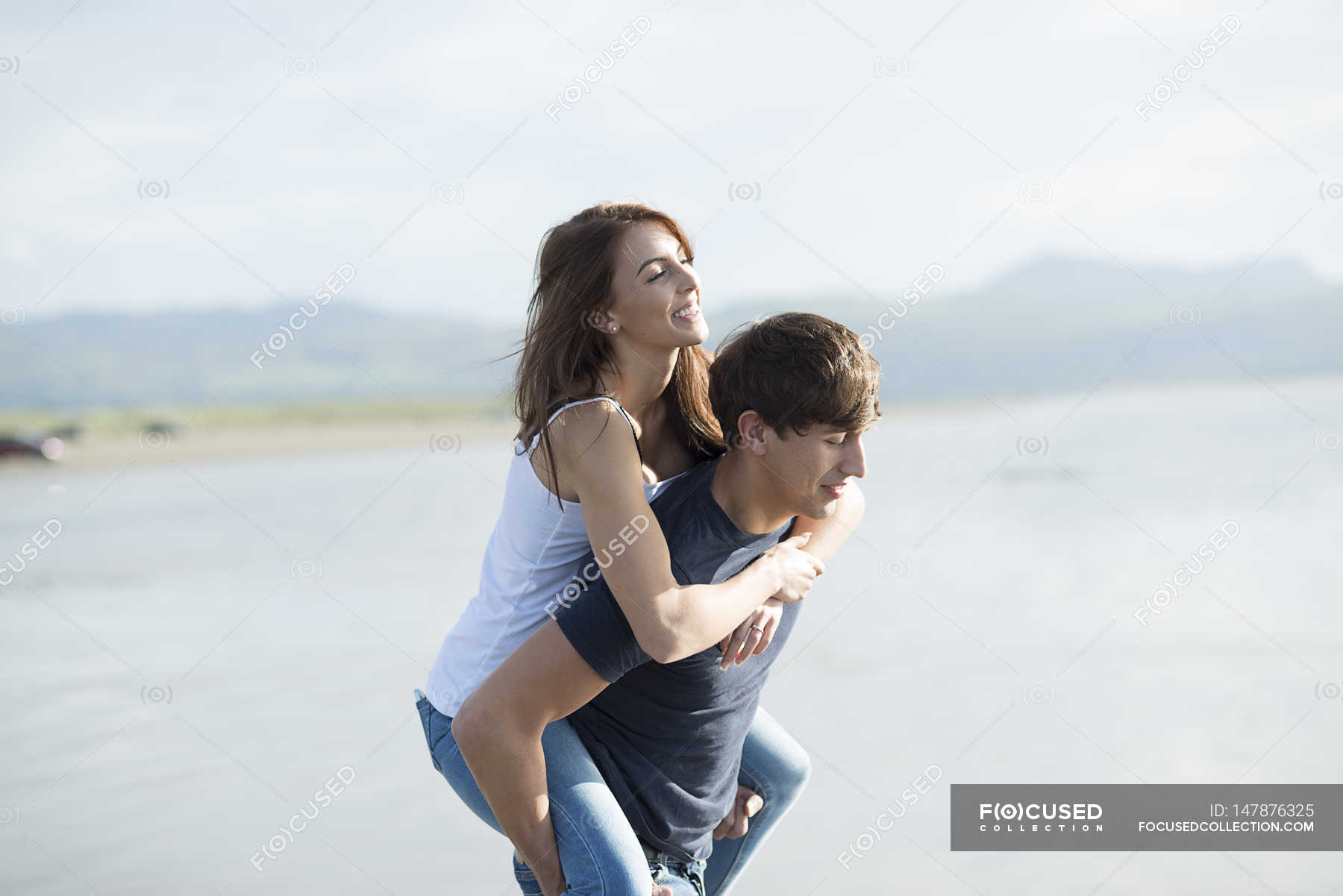 Man Giving Piggyback Ride To His Girlfriend Stock Photo - Image of  cheerful, person: 41022350