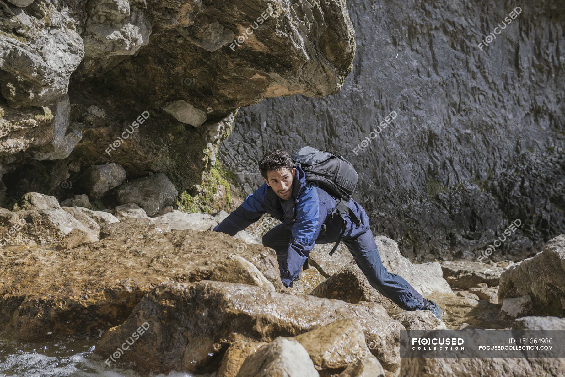 Mountaineer in rugged terrain. — determination, flask - Stock Photo ...