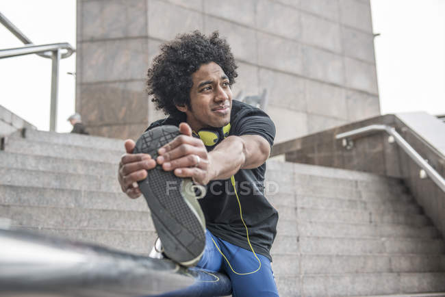 Man limbering up leg for jog — Stock Photo
