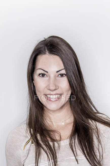 Brunette woman looking at camera — Stock Photo