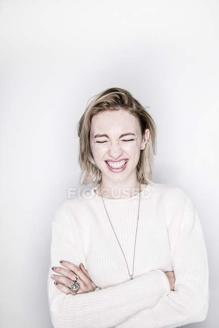 Woman laughing with closed eyes — Stock Photo