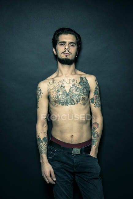 Portrait of tattooed young man — Stock Photo