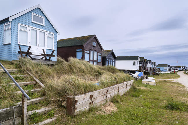 Beach huts on sand dunes — Stock Photo