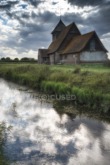 Medieval church landscape against Summer sky — Stock Photo