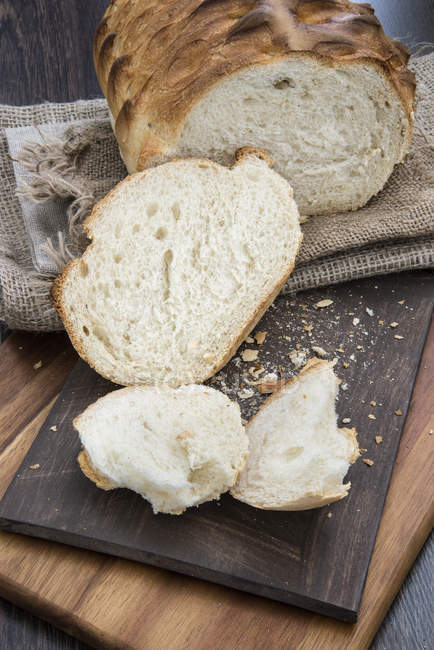 Fresh cut rustic loaf of bread — Stock Photo