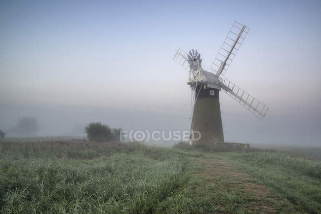 Windmill in stunning landscape — Stock Photo