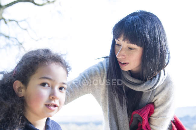 Mother and daughter enjoying early spring — Stock Photo