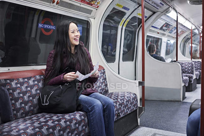 Japanese woman on tube train — Stock Photo