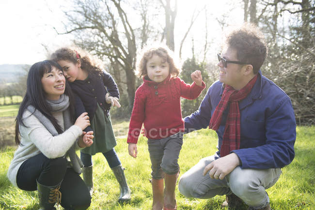 Mother and father with their two children — Stock Photo