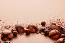 Frame of chocolates on brown — Stock Photo