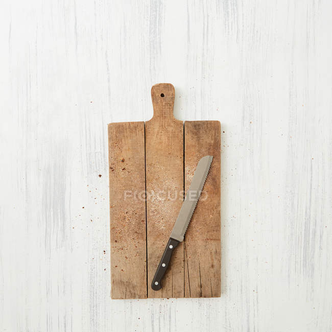 Wooden cutting board, knife — Stock Photo