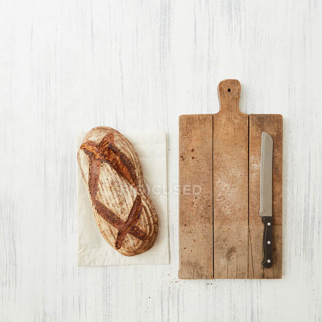 Fresh bread on wooden table — Stock Photo