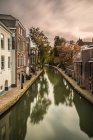 Canal through residential area — Stock Photo