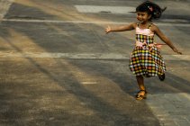Little girl skipping — Stock Photo