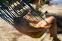 Girl with hat in hammock — Stock Photo