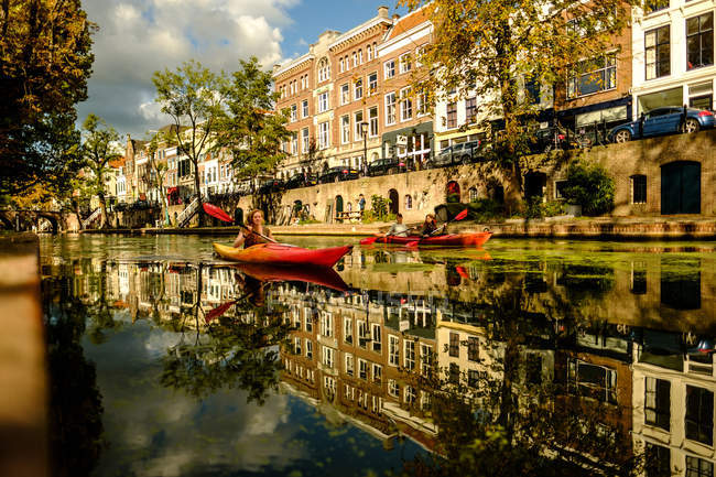 People on kayak boats in canal — Stock Photo