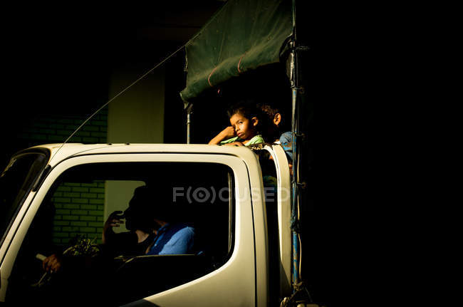 Children riding in truck — Stock Photo