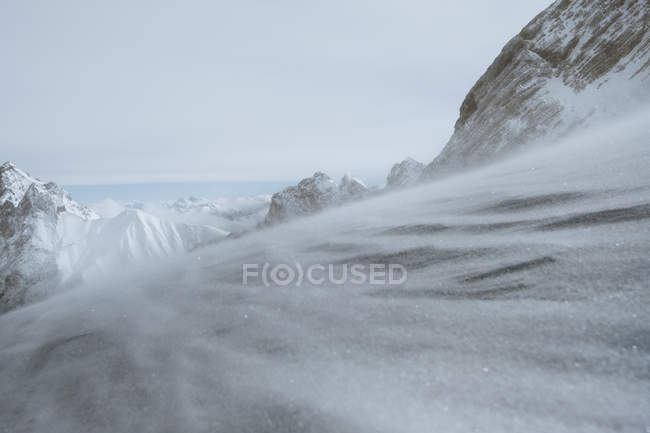 Snowy slope in mountains — Stock Photo