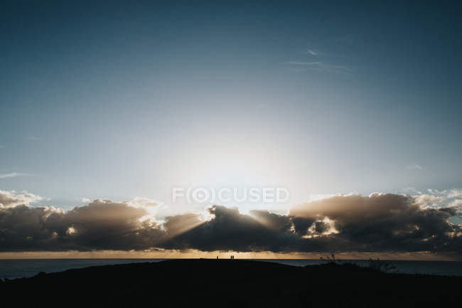 Sunrise over ocean and clouds — Stock Photo