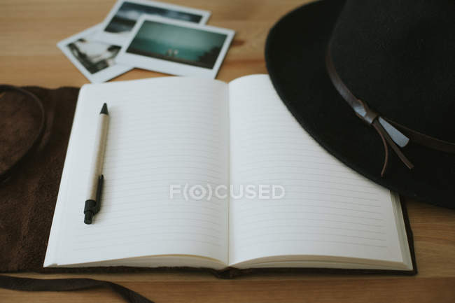 Opened notebook with eyeglasses and pen — Stock Photo