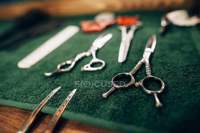 Items for hairdressing on green surface — Stock Photo